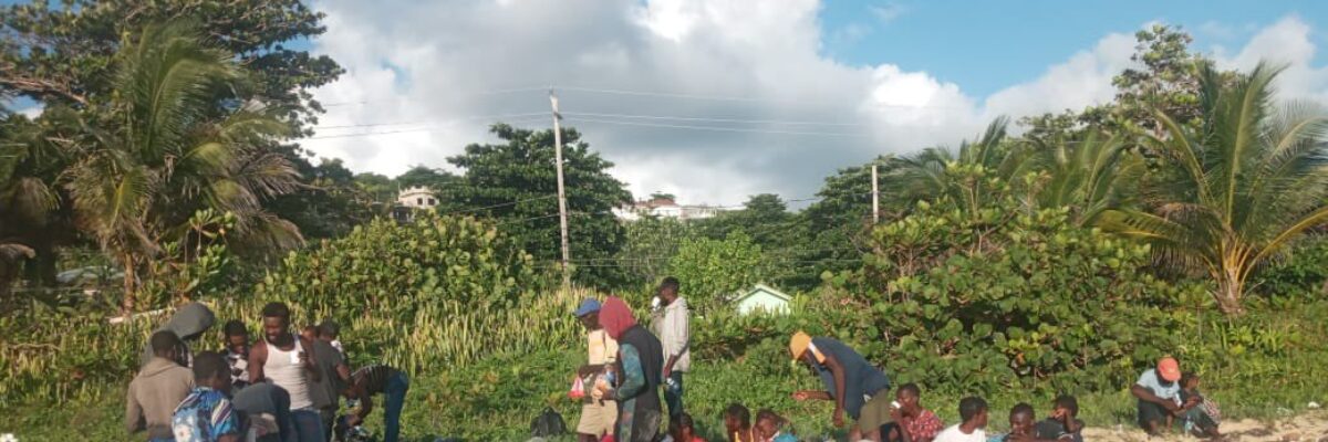 Another set of Haitians arrive at a beach in Portland